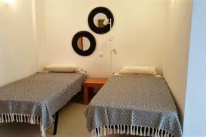Giường trong phòng chung tại Apartamento Golden Sun