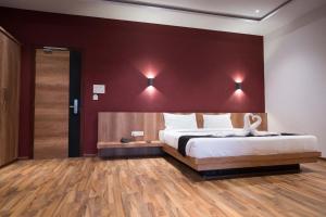 Postel nebo postele na pokoji v ubytování TGN SUITES - HOTEL