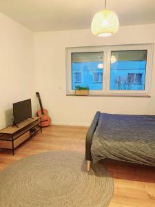 Ένα ή περισσότερα κρεβάτια σε δωμάτιο στο Light-flooded studio in Baunatal