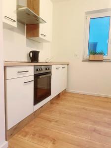 Η κουζίνα ή μικρή κουζίνα στο Light-flooded studio in Baunatal