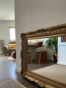 an antique mirror in a living room with a table at Krisant Gold Rural Luxury Privat Pool in Santa Cruz de Tenerife +61 photos