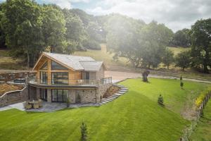 an aerial view of a house with a green lawn at Upper Tumble Cottage in Montgomery