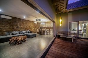 a living room with a couch and a table at Luxury-Sang Villa- Central Sanur in Sanur