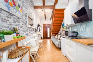 Kuchyň nebo kuchyňský kout v ubytování La casita azul de la playa