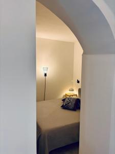 Postel nebo postele na pokoji v ubytování Hd Guesthouse Oasi urbana con parcheggio privato gratuito, fronte stazione