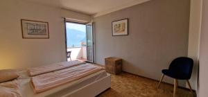 Postel nebo postele na pokoji v ubytování Melide Apartments Lake Lugano close to Swissminiatur & Private Parking on Request