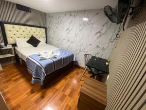 Hotel Jose Ignacio Chepen客房内的一张或多张床位