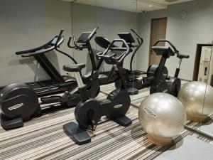 a row of exercise bikes in a gym at Mitsui Garden Hotel Ginza-gochome in Tokyo
