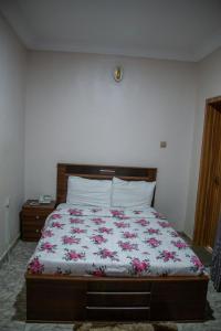 Postel nebo postele na pokoji v ubytování Alnus Hotel