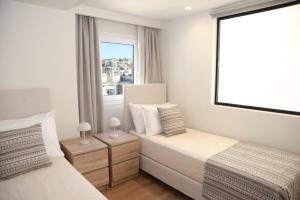 Postel nebo postele na pokoji v ubytování Astric Seaview Penthouse