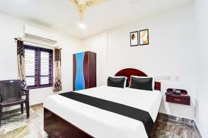 Voodi või voodid majutusasutuse Super Hotel O Kanyakumari Near Sunrise View formerly Jaisas Paradise toas