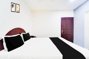 Voodi või voodid majutusasutuse Super Hotel O Kanyakumari Near Sunrise View formerly Jaisas Paradise toas
