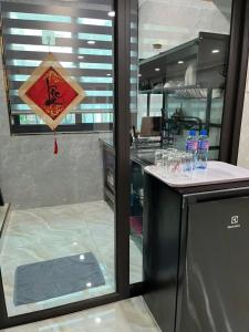 a kitchen with a counter with water bottles on it at Sunny Balcony in Hanoi