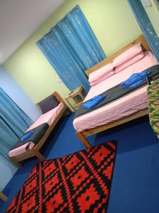 Ένα ή περισσότερα κρεβάτια σε δωμάτιο στο Roomstay Kemuning