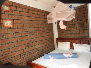 Postel nebo postele na pokoji v ubytování Plastic Bottles House