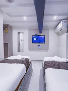 Postel nebo postele na pokoji v ubytování Hotel Winton
