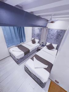 Postel nebo postele na pokoji v ubytování Hotel Winton