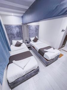 Postel nebo postele na pokoji v ubytování Hotel Winton