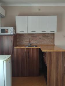 A kitchen or kitchenette at Orgona Vendégház