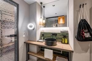 a bathroom with a sink and a mirror at Hotel LÜ - Adults Only in Obertauern +54 photos