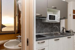 A kitchen or kitchenette at Coltur Suites Még 37 kép