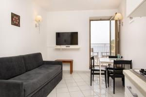 A television and/or entertainment centre at Coltur Suites