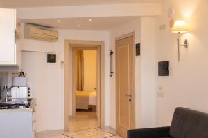 A kitchen or kitchenette at Coltur Suites