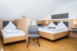 Postel nebo postele na pokoji v ubytování Hotel am Haidel