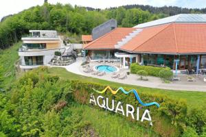 an aerial view of a house with a swimming pool at Ferienwohnungen am Schlossberg Oberstaufen in Oberstaufen