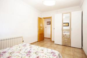 a bedroom with a bed and a door to a hallway at Charming Villa in Linares with Private Pool in Jaén