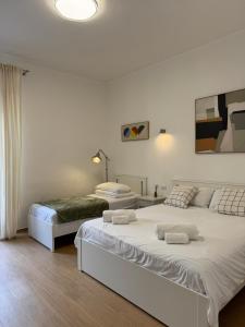 Postel nebo postele na pokoji v ubytování Flat 7 Rome Guesthouse