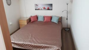 A bed or beds in a room at Orgona Vendégház