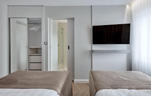 Łóżko lub łóżka w pokoju w obiekcie Hotel Maria