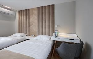 Łóżko lub łóżka w pokoju w obiekcie Hotel Maria