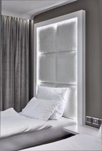 Łóżko lub łóżka w pokoju w obiekcie Hotel Maria