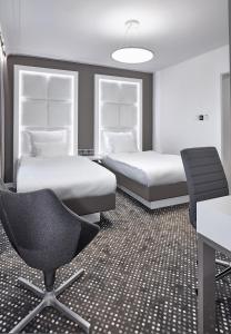 Łóżko lub łóżka w pokoju w obiekcie Hotel Maria