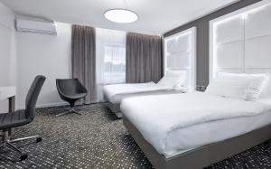 Łóżko lub łóżka w pokoju w obiekcie Hotel Maria