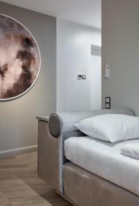 Łóżko lub łóżka w pokoju w obiekcie Hotel Maria