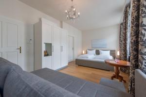 Rúm í herbergi á Altstadthotel Wolf-Dietrich