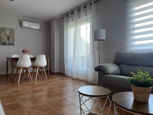 a living room with a couch and a table at Balcón de La Iruela I in La Iruela