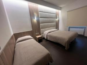Voodi või voodid majutusasutuse Hotel Ristorante Borgo Antico toas