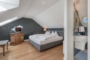 Rúm í herbergi á Altstadthotel Wolf-Dietrich