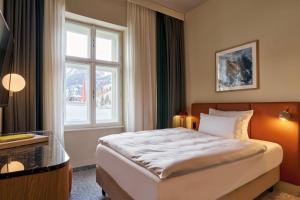 Postel nebo postele na pokoji v ubytování Urban Nature Bad Gastein - Badeschloss