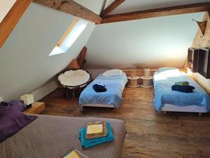 Posteľ alebo postele v izbe v ubytovaní Chambre d'Hôtes - Eco Gîte la Grange