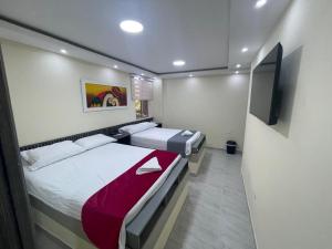 Hotel Magistral Suiter客房内的一张或多张床位