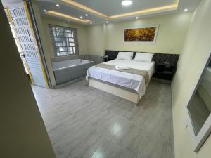 Hotel Magistral Suiter客房内的一张或多张床位