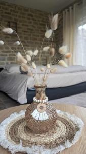 Giường trong phòng chung tại Gîte Bohème