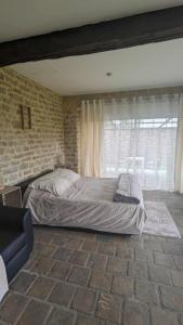 Giường trong phòng chung tại Gîte Bohème