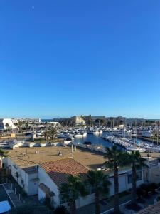 a view of a marina with boats at Village naturiste Appart B Port Soleil in Cap d'Agde
