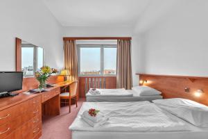 Postel nebo postele na pokoji v ubytování Abitohotel